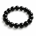 Natural Black Obsidian Crystal Bracelet for spiritual meditation featuring polished black round gemstone beads in 8mm and 10mm sizes with a stretchable design.