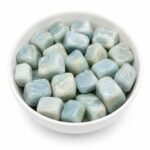 Aquamarine tumble stones natural light blue polished healing crystals in a white bowl
