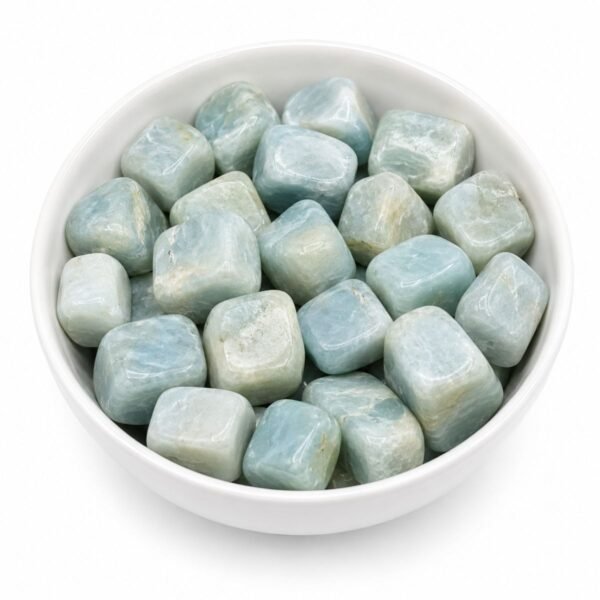 Aquamarine tumble stones natural light blue polished healing crystals in a white bowl