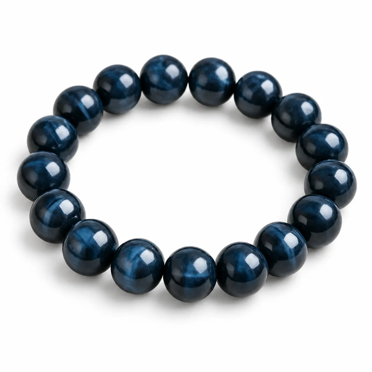 Natural Blue Tiger Eye Crystal Bracelet for Calmness & Confidence Natural Blue Tiger Eye Crystal Bracelet for men and women featuring polished blue-grey gemstone beads with a silky shimmer, available in 8mm and 10mm round beads for calmness and confidence.