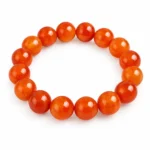 Natural Carnelian Crystal Bracelet for confidence and motivation featuring polished orange, reddish-orange and amber gemstone beads in 8mm and 10mm round sizes with a stretchable design.