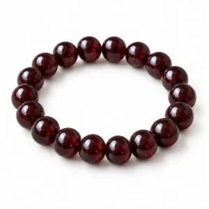 Natural Garnet Crystal Bracelet for men and women featuring polished round natural Garnet gemstone beads in 8mm and 10mm sizes with a comfortable stretchable design.