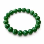 Natural Green Jade Crystal Bracelet for men and women featuring polished green round gemstone beads in 8mm and 10mm sizes with a comfortable stretchable design.