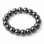 Natural Hematite Crystal Bracelet for grounding and meditation featuring polished metallic-grey gemstone beads in 8mm and 10mm round sizes with a comfortable stretchable design.