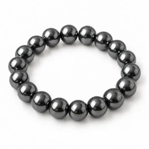 Natural Hematite Crystal Bracelet for grounding and meditation featuring polished metallic-grey gemstone beads in 8mm and 10mm round sizes with a comfortable stretchable design.