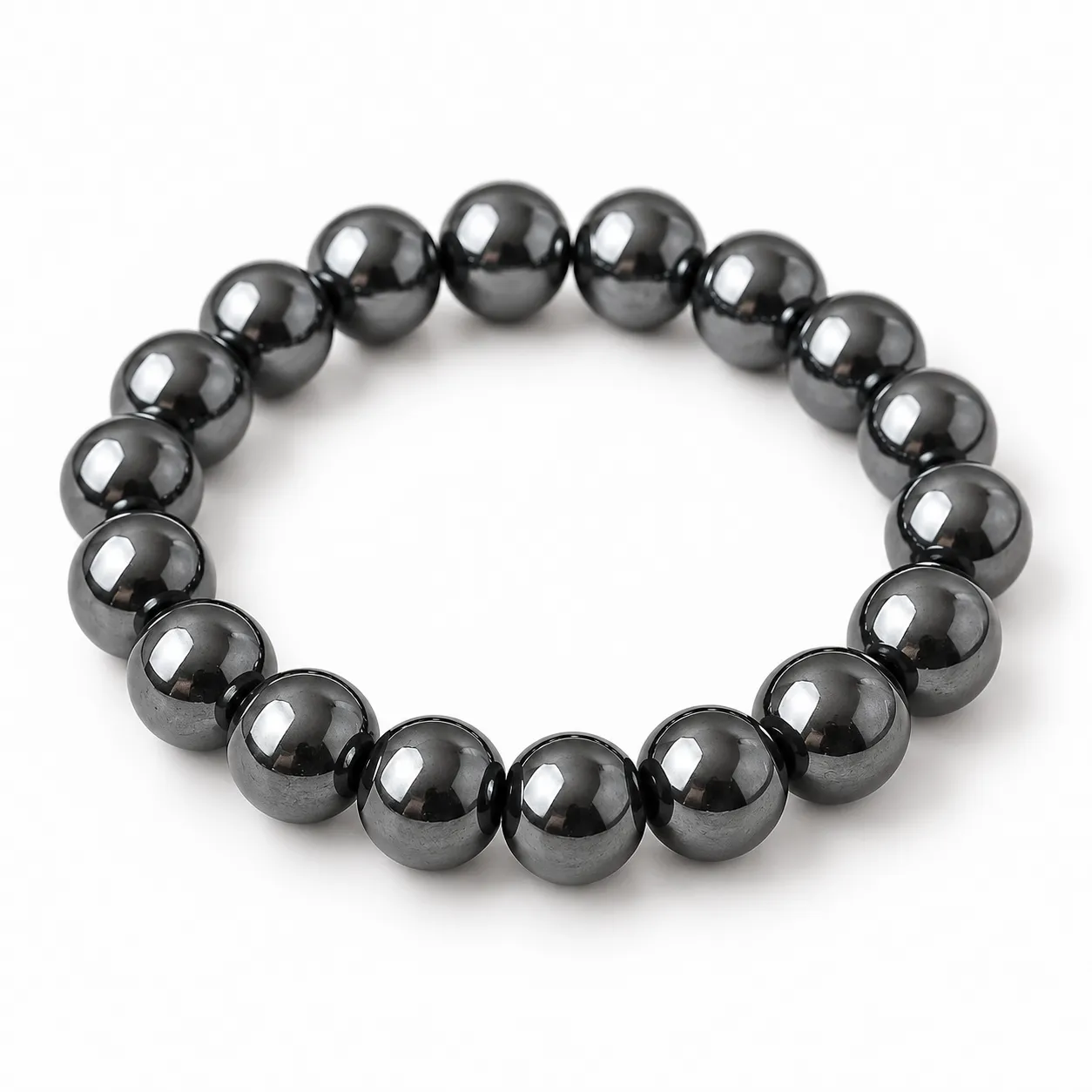 Natural Hematite Crystal Bracelet for Grounding & Meditation Natural Hematite Crystal Bracelet for grounding and meditation featuring polished metallic-grey gemstone beads in 8mm and 10mm round sizes with a comfortable stretchable design.