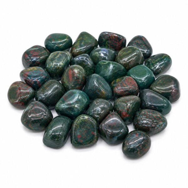 Natural Bloodstone tumble stones with deep green color and red inclusions on a white background