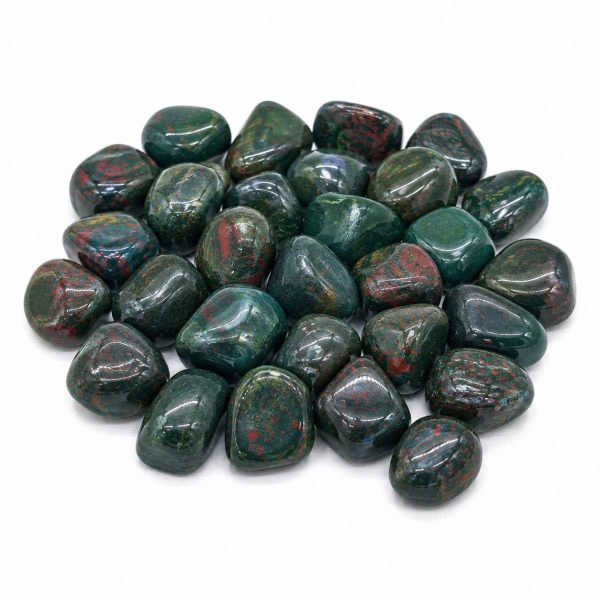 Natural Bloodstone Tumble Stones Natural Bloodstone tumble stones with deep green color and red inclusions on a white background