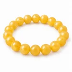 Natural Yellow Calcite Crystal Bracelet for men and women featuring beautiful golden-yellow natural gemstone beads in 8mm and 10mm round sizes with a comfortable stretchable design.