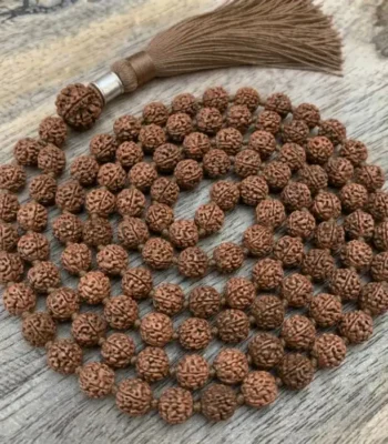 Rudraksha Mala made of natural brown rudraksha beads strung together for meditation and spiritual practice.