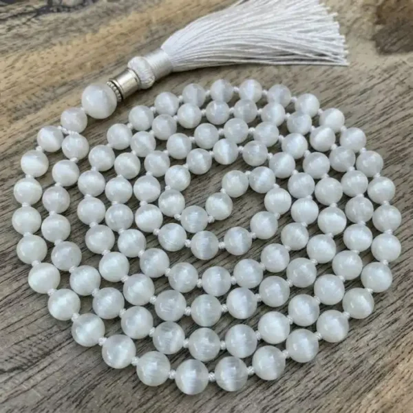 Selenite mala with luminous white beads and a soft tassel, designed for meditation and spiritual cleansing.