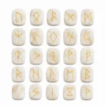 Natural moonstone rune stone with soft white sheen and engraved rune design