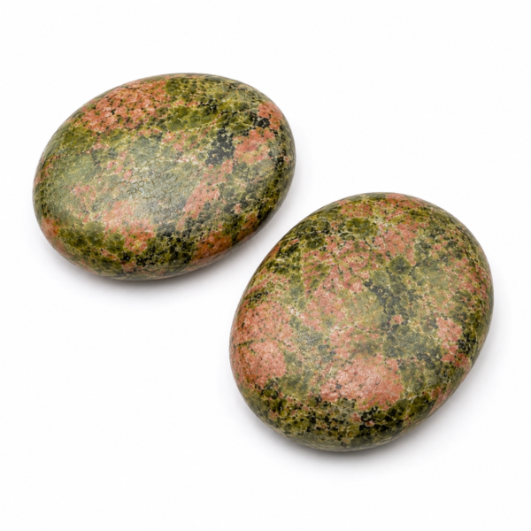 Two natural Unakite palm stones with green and pink mottled patterns on a plain white background