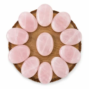 Natural rose quartz palm stone with soft pink colour and smooth polished surface