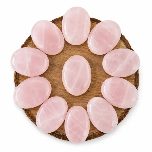 Natural rose quartz palm stone with soft pink colour and smooth polished surface
