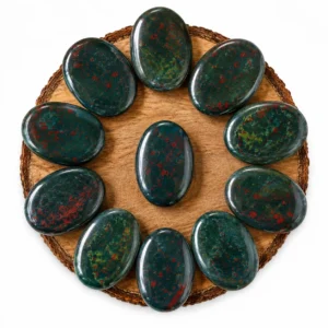 Natural bloodstone palm stone with deep green colour and distinctive red inclusions