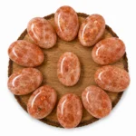 Natural sunstone palm stone with warm peach colour and natural sparkling inclusions