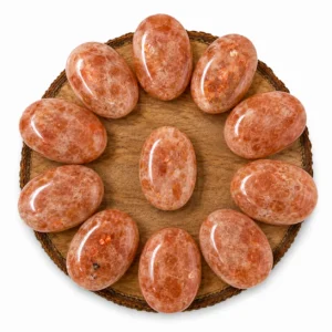 Natural sunstone palm stone with warm peach colour and natural sparkling inclusions