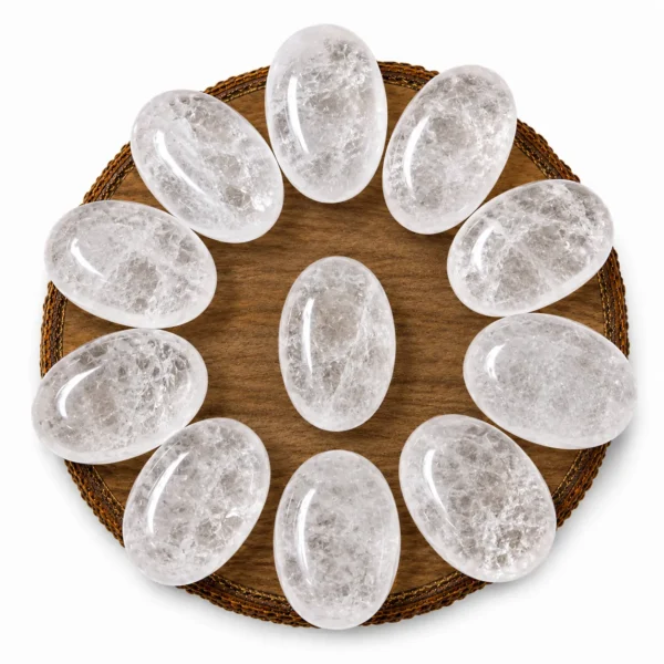 Natural clear quartz palm stone with translucent appearance and smooth polished surface