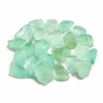 Natural fluorite rough stone featuring beautiful translucent colours and raw crystal texture