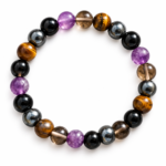 Natural five-stone healing crystal bracelet featuring Black Tourmaline, Amethyst, Smoky Quartz, Tiger Eye and Hematite round beads on a white background.