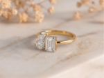 Toi Et Moi emerald and pear lab-grown diamond ring with gold band and elegant two-stone design