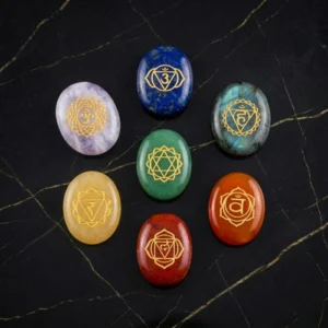 7 Chakra Zibu Coins Set featuring engraved Zibu symbols on colorful chakra stones arranged in a complete set.