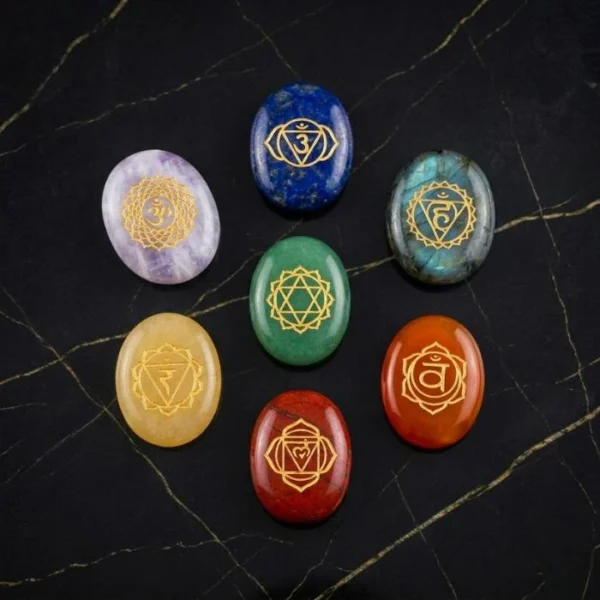 7 Chakra Zibu Coins Set featuring engraved Zibu symbols on colorful chakra stones arranged in a complete set.