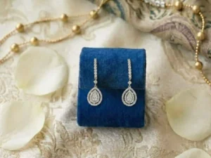 Pear-Shaped Double Halo Diamond Drop Earrings featuring pear-shaped center stones surrounded by sparkling double halos.