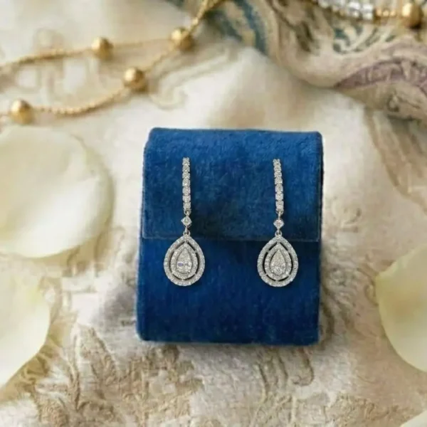 Pear-Shaped Double Halo Diamond Drop Earrings featuring pear-shaped center stones surrounded by sparkling double halos.