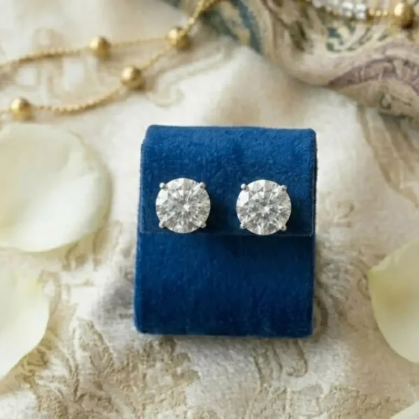 Round Solitaire Diamond Stud Earrings featuring classic round-cut diamonds in a timeless solitaire setting.