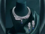 Sapphire Leaf Elegance CVD Diamond Necklace Set featuring leaf-inspired sapphire accents with sparkling lab-grown diamonds and matching earrings.