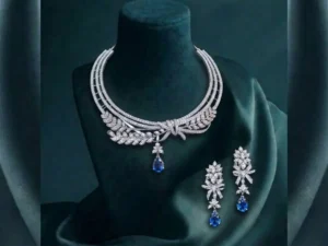 Sapphire Leaf Elegance CVD Diamond Necklace Set featuring leaf-inspired sapphire accents with sparkling lab-grown diamonds and matching earrings.