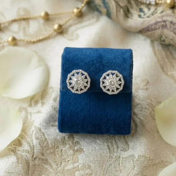 Snowflake Earrings featuring a delicate snowflake-inspired design with sparkling diamonds.