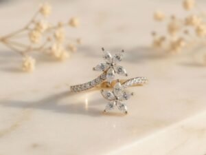 Twin Blossom Vine Ring featuring twin floral motifs with delicate vine-inspired detailing and sparkling diamonds.