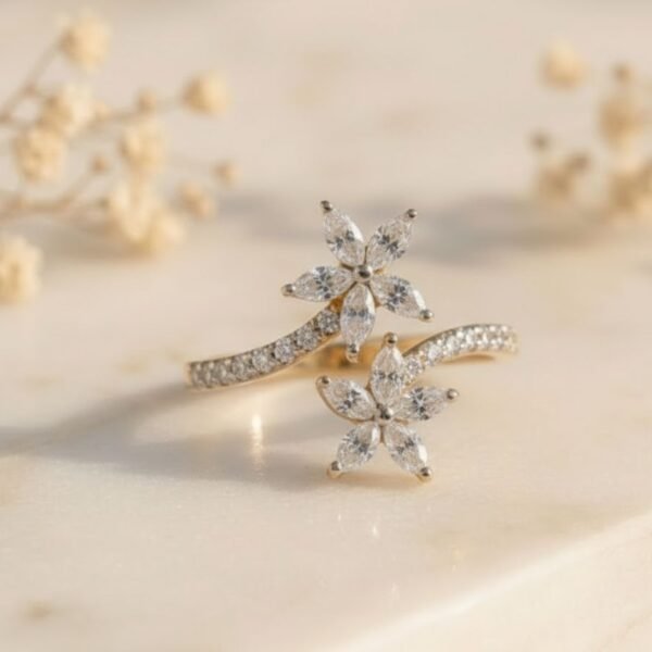 Twin Blossom Vine Ring featuring twin floral motifs with delicate vine-inspired detailing and sparkling diamonds.