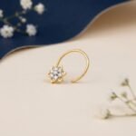 Petal cluster diamond nose pin showing front, side, top, and angled views with floral design and sparkling diamonds