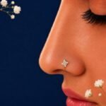 Front view of dainty floral diamond nose ring delicate design