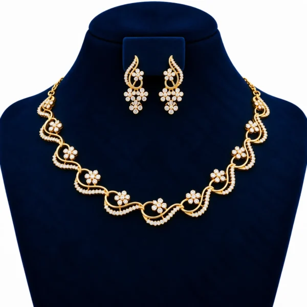Yellow gold floral wave lab grown diamond necklace set with round diamond flower motifs and matching floral drop earrings on navy blue display