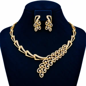18K gold oval floral lab grown diamond necklace for women with matching drop earrings displayed on a navy blue jewellery bust