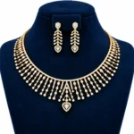 18K gold lab grown diamond necklace set with cascading diamond strands, pear-shaped centre drop and matching earrings