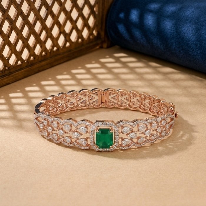 Infinity-Ribbed-Rose-Lab-Diamond-Vine-Bangle-Rose-Gold A rose gold ribbed bangle featuring alternating vertical rows of pink stones and white lab diamonds on a neutral background.
