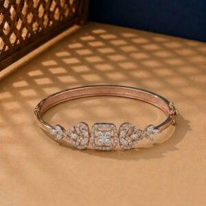 A handcrafted diamond vine bracelet with a central square halo in rose gold.