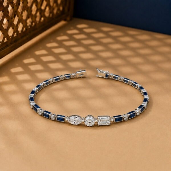 Art Deco style lab-grown diamond and blue sapphire bracelet in white gold setting.