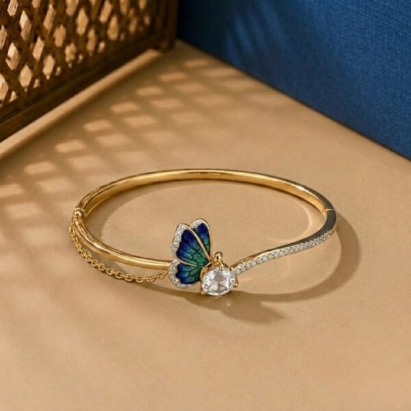 A handcrafted diamond vine bracelet featuring blue sapphires and multi-shape diamonds in a white gold setting.