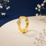 Signature solitaire diamond nose ring shown in front view, side view, top view, and angled perspective highlighting single diamond design
