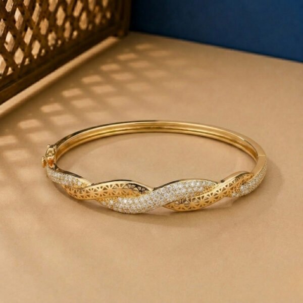 A handcrafted yellow gold diamond vine bracelet featuring a woven lattice pattern and pavé diamonds.