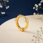 Signature solitaire diamond nose ring shown in front view, side view, top view, and angled perspective highlighting single diamond design