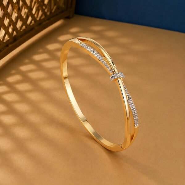 A rose gold diamond vine bracelet featuring a central pavé-set knot on a neutral background.