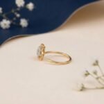 Petal cluster diamond nose pin showing front, side, top, and angled views with floral design and sparkling diamonds